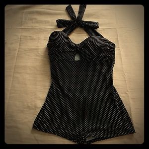 Black & white polka dot one-piece bathing suit.